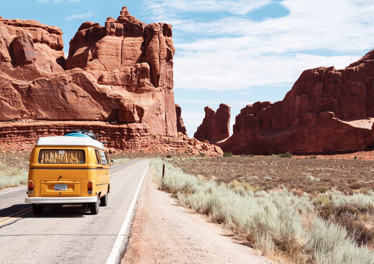 An open road stretching into the distance on a sunny day